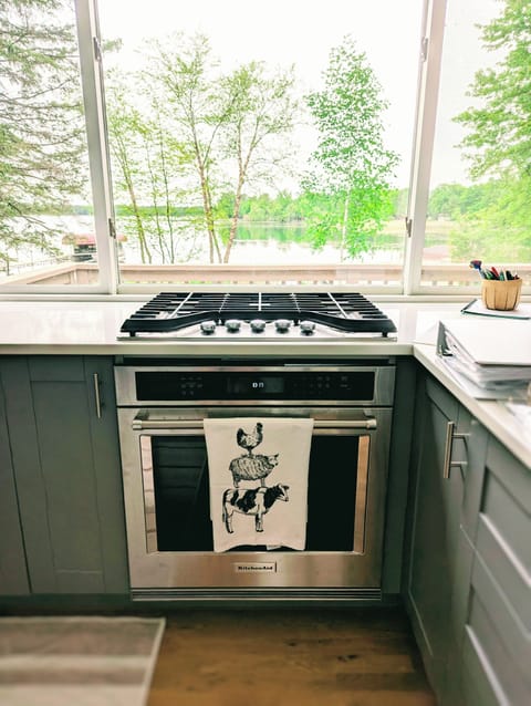 Gas stove and oven-ready for meal preparation while enjoying the view of nature.