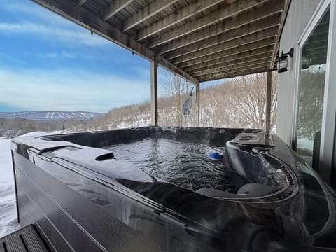 Hot tub: Private hot tub with slope views