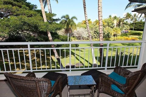 Sip morning coffee or evening wine while overlooking this peaceful, palm lined tropical landscape.