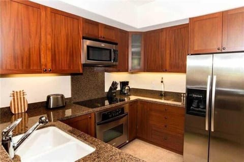 A modern kitchen with stainless appliances, full cabinetry, and plenty of counter space for all needs.

