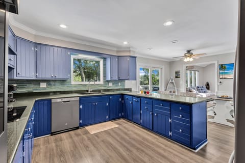 Whip up family meals or snacks in the home's fully-equipped kitchen, complete with modern appliances like oven, plenty of counter space and a sunny breakfast nook.