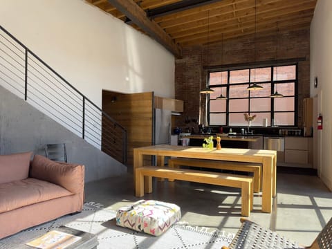 Spacious open-concept design with industrial touches and a welcoming gathering space.