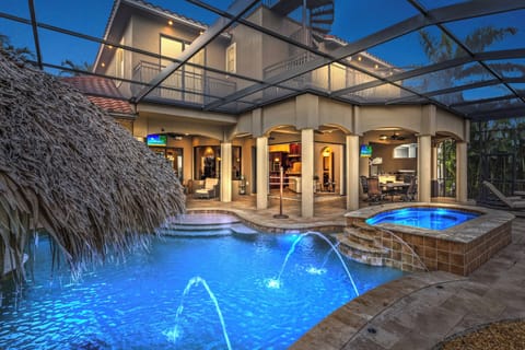 Outdoor oasis complete with heated pool, spa, and outdoor kitchen.