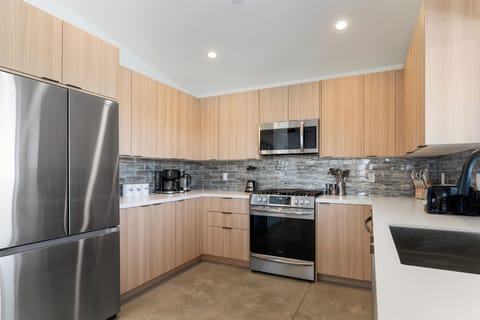 Stylish, functional kitchen with stainless steel appliances.