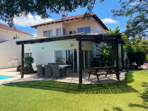 Patio with seating area and view.