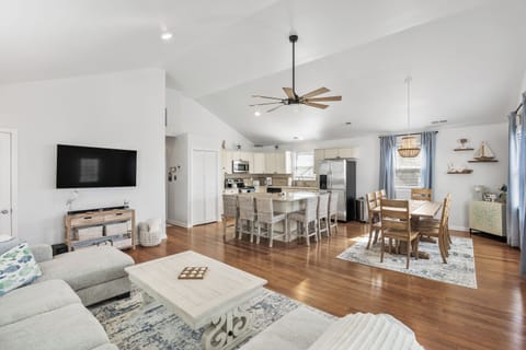 Open living room area with the view of the kitchen and dining
