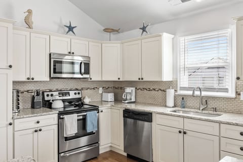 Sleek kitchen with modern amenities
