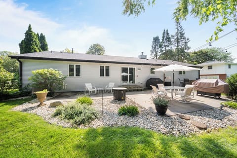 Spacious back yard with grill for cooking and dining.