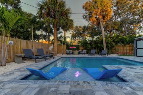 Enjoy the heated pool with sunshelf and chaise loungers. 