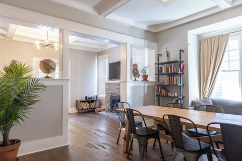 Cozy living room with bright light and historic charm.