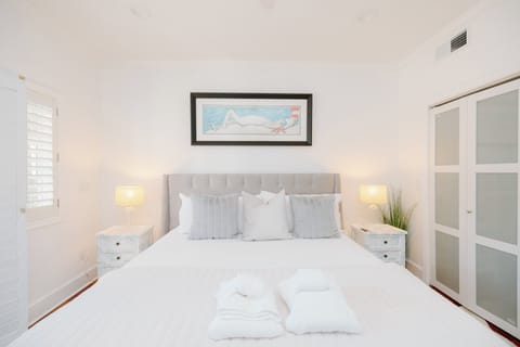 Luxurious king bedroom featuring plush linens, Smart TV, and a calming retreat after a day exploring downtown Wilmington or nearby beaches.