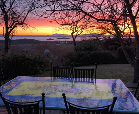 Dining table with a winter sunset on lake