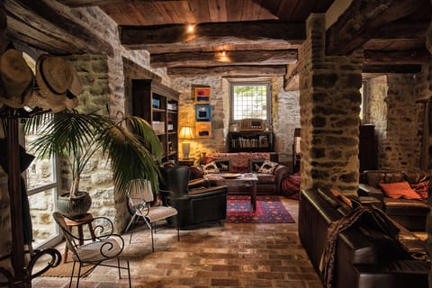 Huge living room with a cool atmosphere in summertime - library with wines
