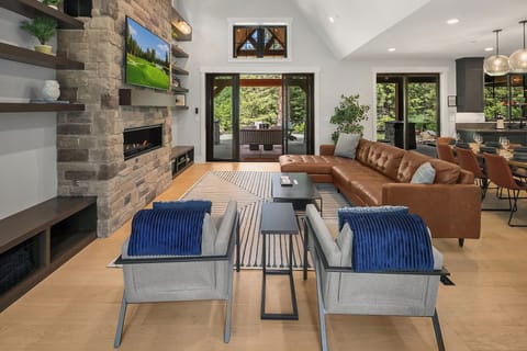 100 Bullwheel. - Open-concept great room with 60" Samsung TV and gas fireplace.