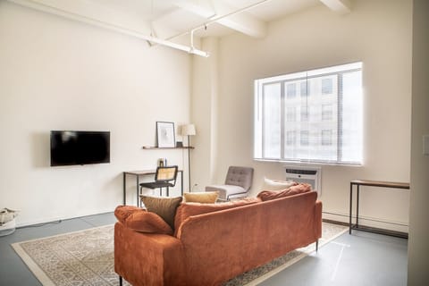 Bright, open-concept living area designed for both relaxation and productivity.