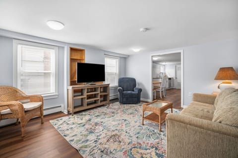 Living room with TV and comfy seating arrangement