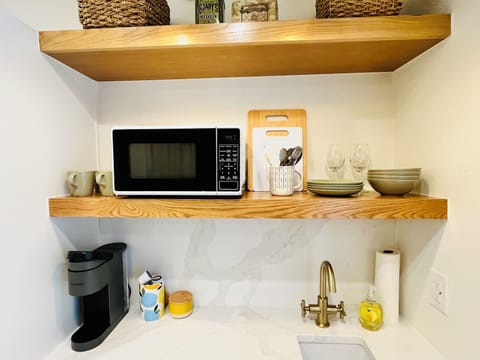 Kitchenette with plates, dishes, silverware