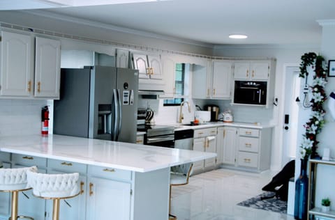 Chef's kitchen on main level with stainless steel appliances