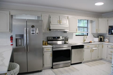 Chef's kitchen on main level with stainless steel appliances