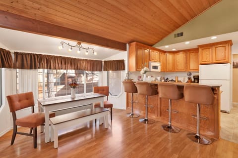 Fully equipped cabin kitchen with ample cabinetry, stove, fridge, microwave, and coffee maker—perfect for cooking meals, morning coffee, and feeling right at home on your stay.