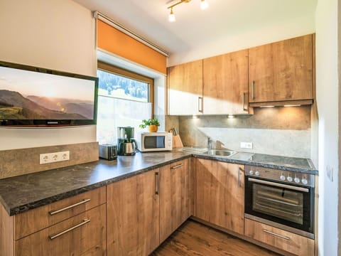 Wood, Interior Design, Cabinetry, Flooring, Countertop, Kitchen, Room, Ceiling, Home Appliance, Major Appliance