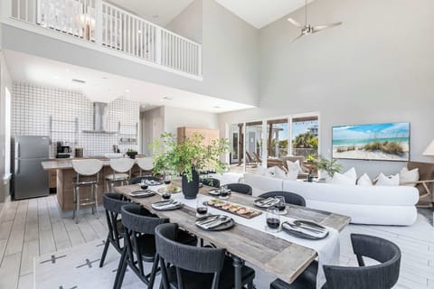 The seamless flow between the living and dining spaces enhances the experience, allowing for easy movement and interaction during meals and social gatherings.