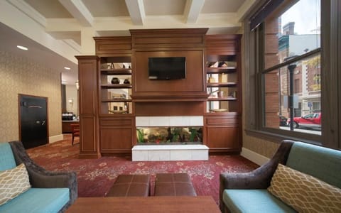 Settle into plush seating beside the stylish fireplace feature.