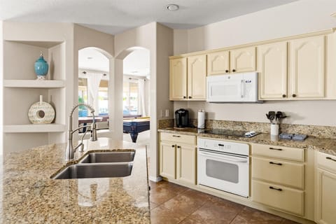 With top-of-the-line appliances and a spacious island is perfect for both culinary creativity and casual gatherings.