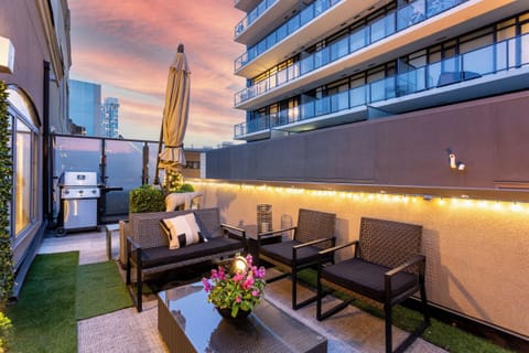 Main floor balcony - Plenty of seating, BBQ, umbrella and CT tower views.