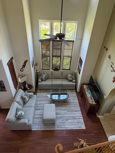 
Bird’s eye view of the open concept living space with soaring ceilings and glowing natural light.