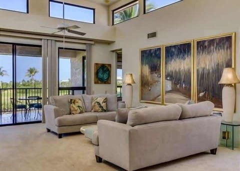 Soak in sunlight and panoramic greens from this airy, art filled lounge with plush seating.