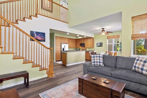 Bright, airy living room with soaring ceilings, cozy seating, and an inviting open concept flow.

