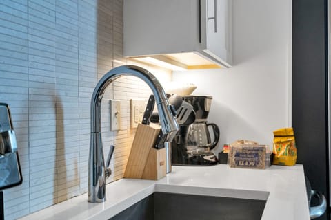 Enjoy a deep sink, under-cabinet lighting, and everything you need—from coffee to cookware—for a convenient, comfy stay.