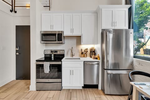 Cook like you're at home with stainless steel appliances, sleek cabinetry, and all the essentials right at your fingertips.