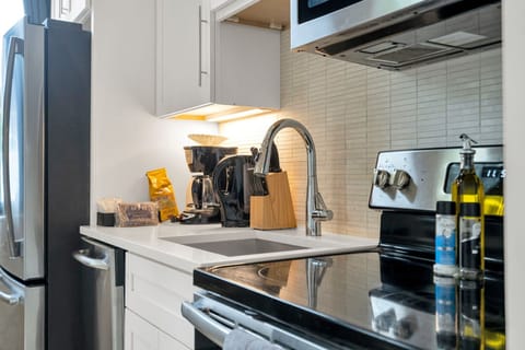 Stainless steel appliances, coffee essentials, and cooking tools all ready for your stay.