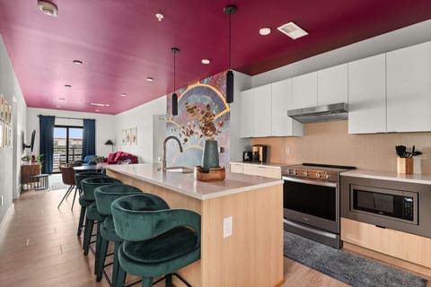 The Rayleigh Kitchen - Sleek and functional, this kitchen features a counter table with chairs, perfect for casual dining or morning coffee.