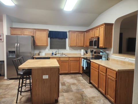 Full kitchen available with kitchenware and appliances.
