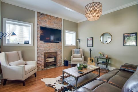 Kick back in the super comfy, spacious living room with a reclining sofa and a smart TV ready for streaming.