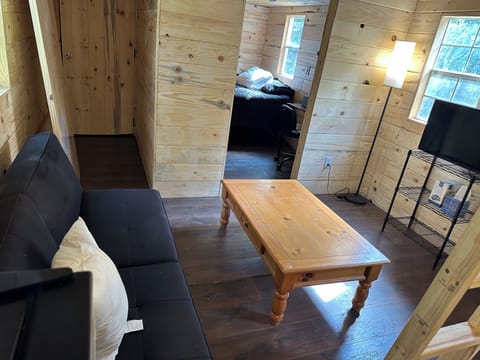 Relaxing living space with games, books, and cozy vibe