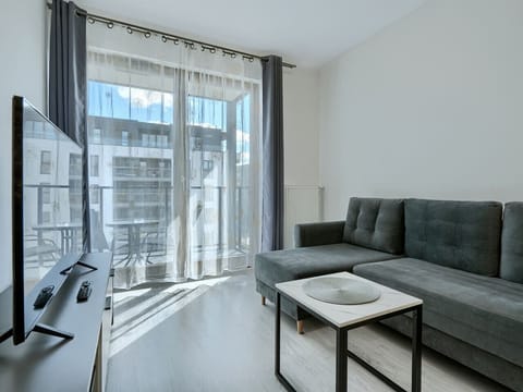 Living Room with Sofa Bed, Smart TV and Dining Table | Book Now with RENTUJEMY.COM