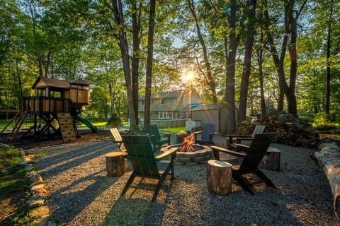Gather `round the cozy firepit—perfect for s`mores, stories, and stargazing by the lake.