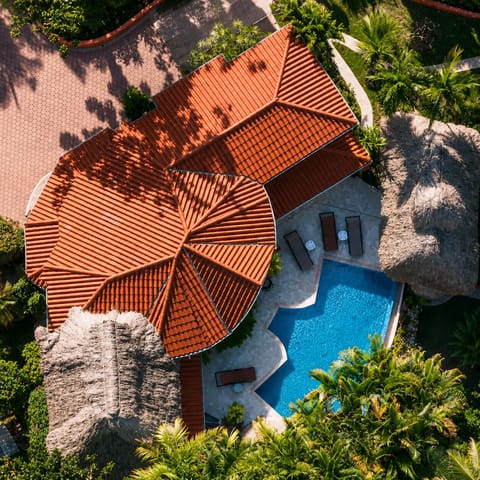 Private hillside villa with a stunning infinity pool surrounded by Belize's lush rainforest.