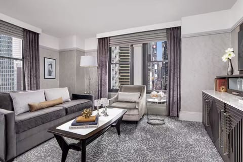 Lounge comfortably with city views and elegant, modern seating.