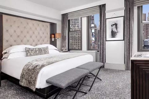 Soak up daylight and skyline views from your bed.