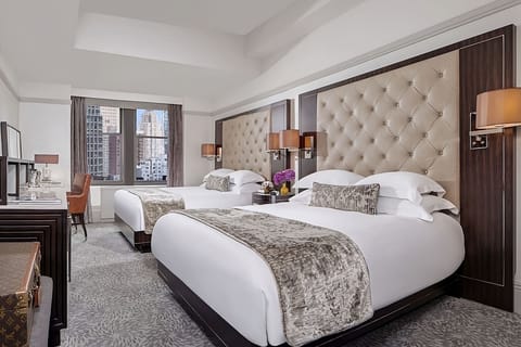 Stretch out together in two plush beds with airy space.