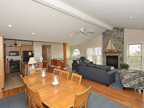 Step into the heart of this exquisite beach home where a spacious, open-concept layout seamlessly integrates the living and dining areas, inviting you to entertain and enjoy stunning ocean views from every angle.