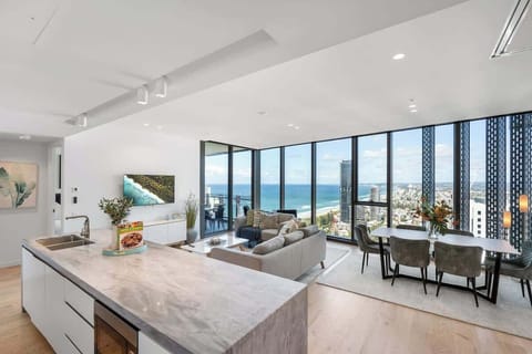 Expansive sub-pen's living room featuring soaring ceilings, 2.85m high floor-to-ceiling windows, and stunning  coastline views.
