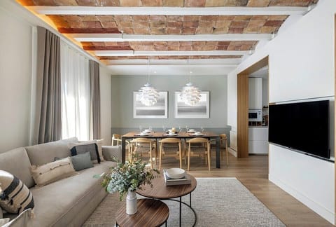 The spacious living room can comfortably seat large groups and features a large-screen smart TV with Netflix and all other major streaming services.