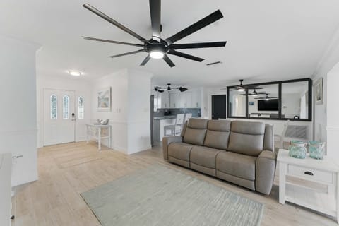 Relax in the roomy, inviting living area featuring a comfortable, wide couch perfect for lounging after a day of adventure.