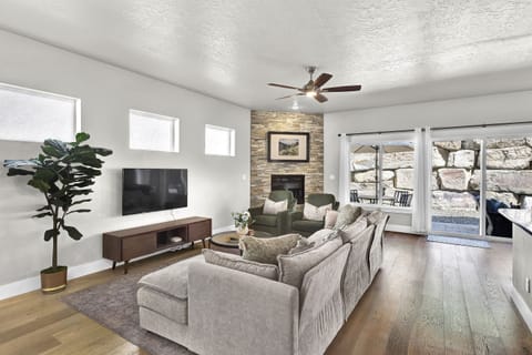 Living Room with TV, gas fireplace, and comfortable seating